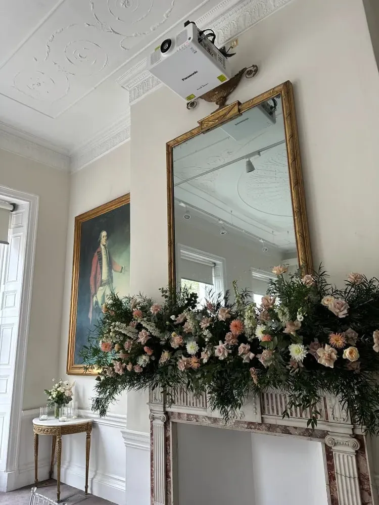 Second mantelpiece garland in foliage and cream-blush roses